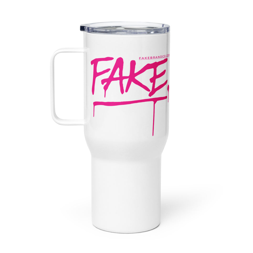 White travel mug with OG PINK FAKE logo.